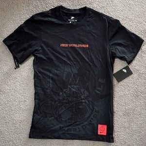 Nike Black Short-Sleeve Worldwide Graphic Tee with Red Accents